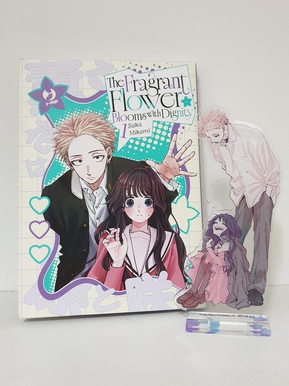 Copertina variant del primo volume e stand acrilico dei protagonisti Copertina variant del primo volume e stand acrilico dei protagonisti